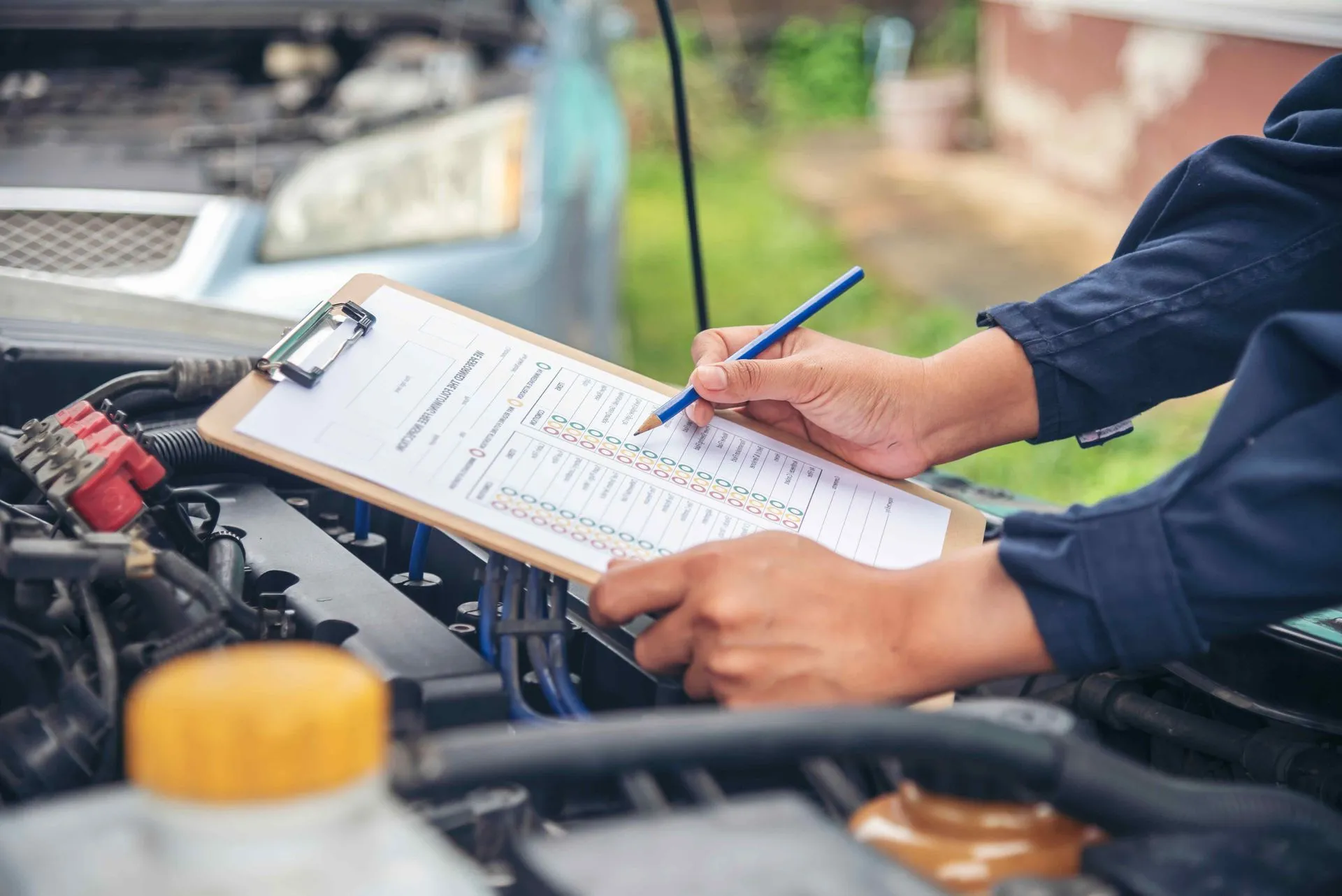 Technician checking an engine bay